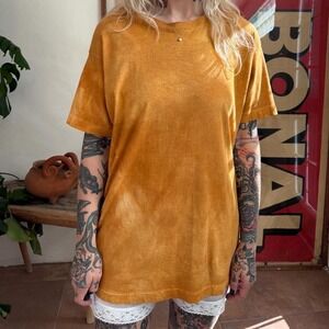 Vintage 1980s 1990s overdyed short sleeve t shirt in an orange camel brown color